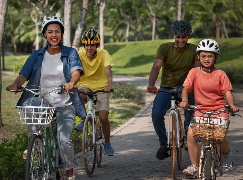 full-shot-family-cycling-outdoors full-shot-family-cycling-outdoors