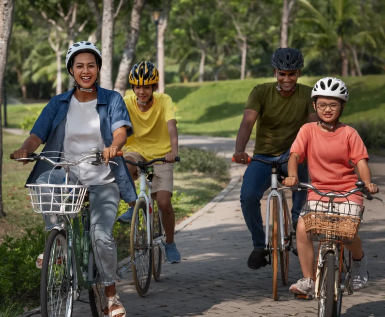 full-shot-family-cycling-outdoors